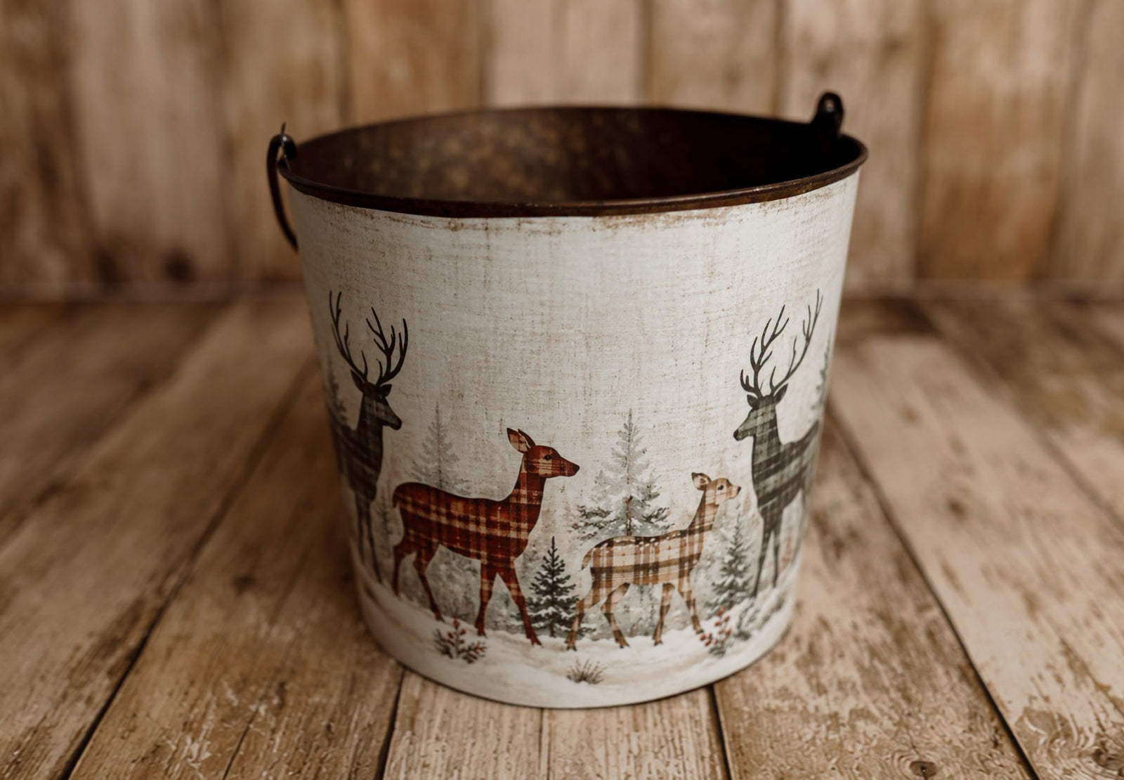 Winter Herd newborn photography bucket cover featuring plaid deer, snowy evergreen trees, and vintage woodland Christmas scenery in muted red and green.