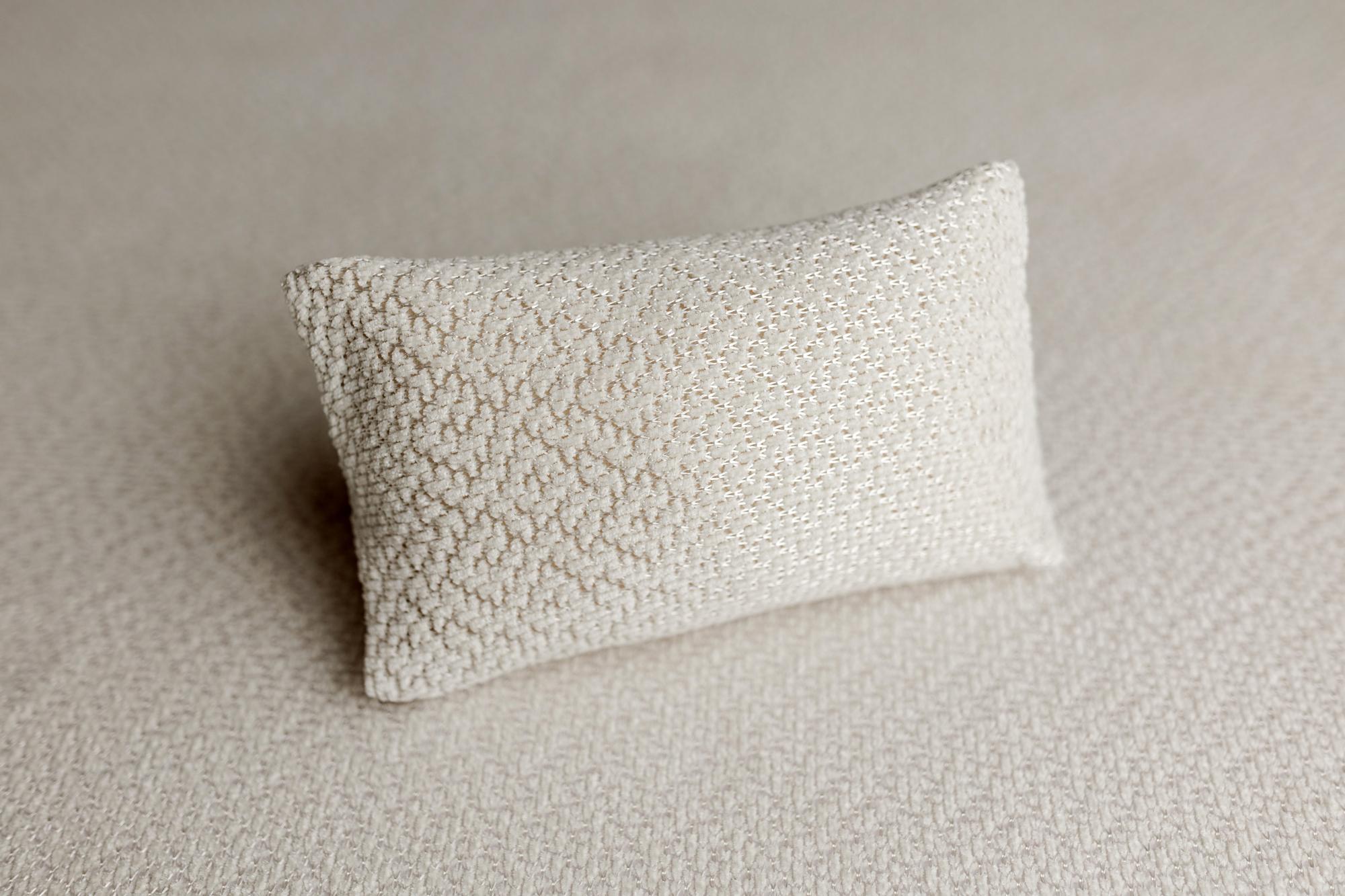 Ivory newborn posing pillow case with a subtle textured knit and delicate woven shimmer for photography.