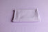 Soft lavender ribbed fabric photography drop and matching folded wrap for newborn styling.