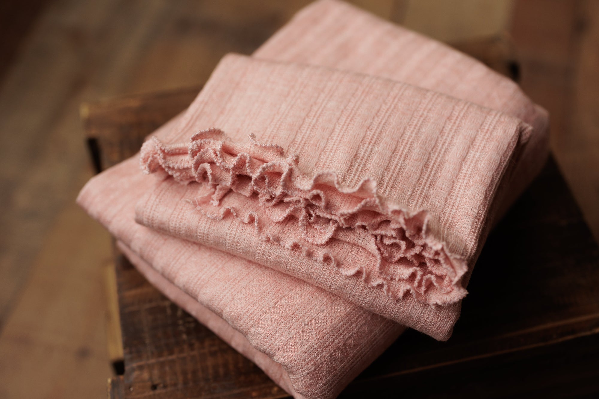 Baby pink newborn photography posing fabric and matching ruffle wrap in soft, stretchy ribbed knit.