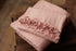Baby pink newborn photography posing fabric and matching ruffle wrap in soft, stretchy ribbed knit.