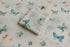Creamy neutral newborn posing fabric and wrap with sage, teal, and peach butterfly prints and delicate lace trim.