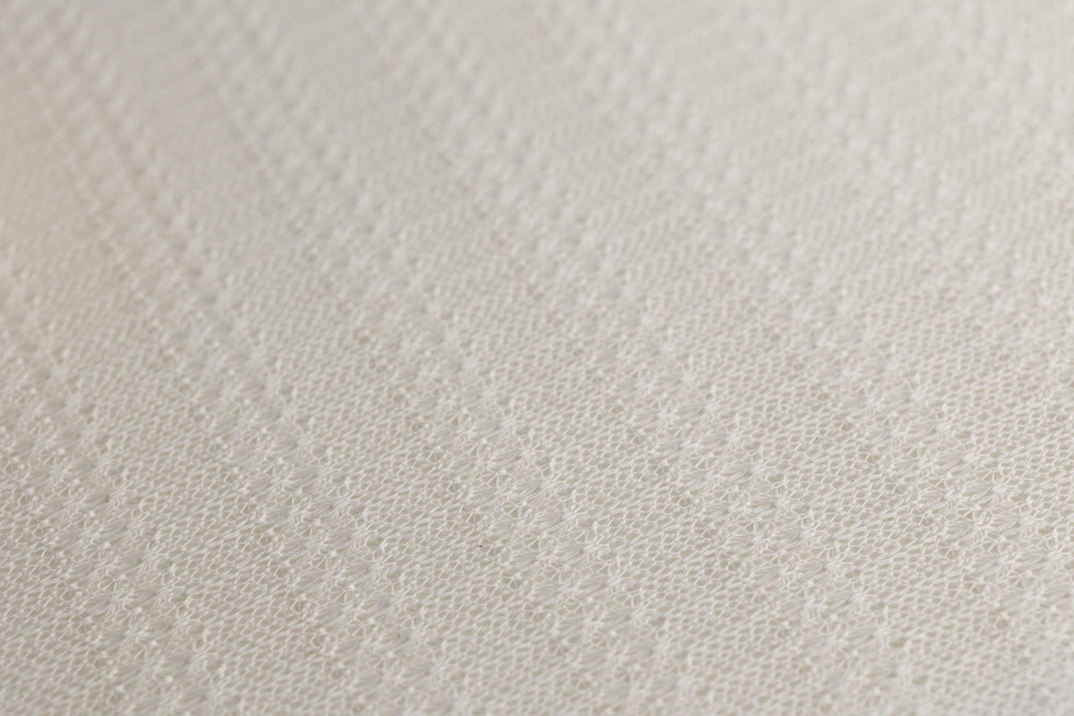 Soft ivory newborn photography posing fabric with a delicate, open-knit texture for organic layering and swaddling.