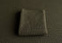 Deep forest green newborn photography fabric with a soft, woven texture and a folded matching wrap.