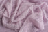 Soft, muted lavender stretchy lace wrap layered over cozy, textured Nest fabric for newborn photography.