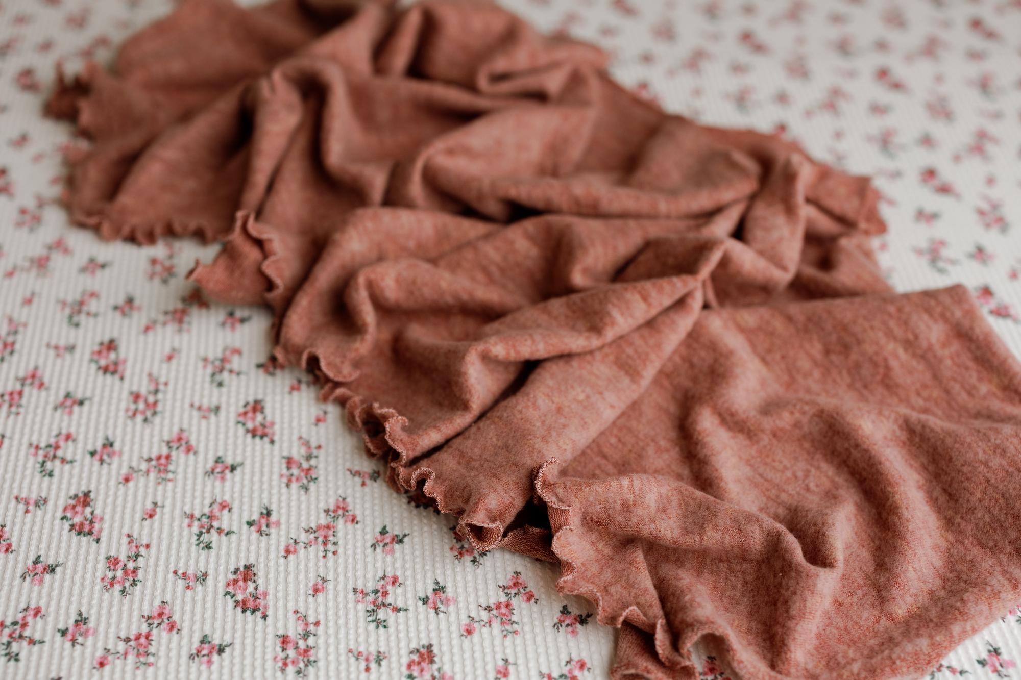 Primrose floral newborn posing fabric with a textured pink ruffle wrap for photography.