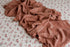 Primrose floral newborn posing fabric with a textured pink ruffle wrap for photography.