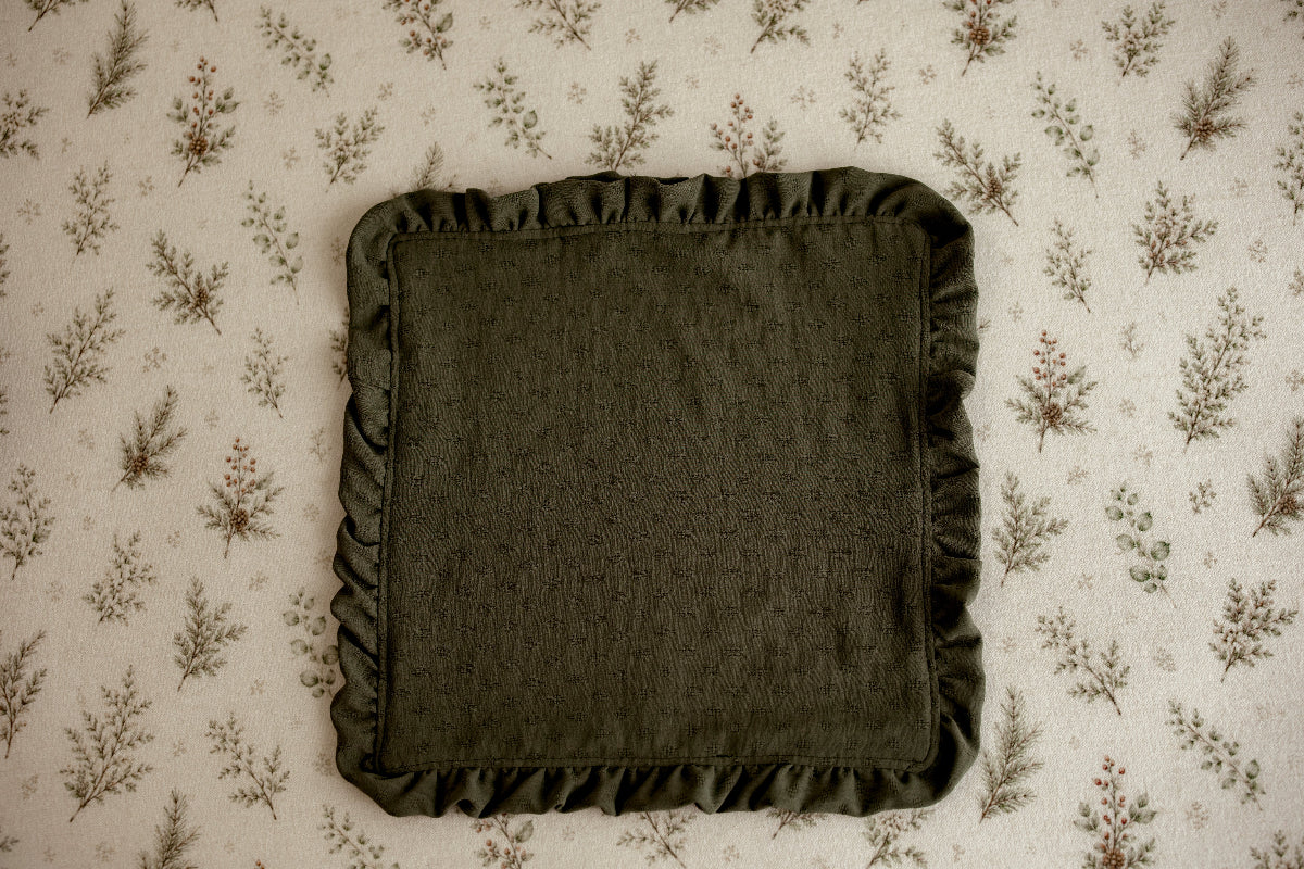 Olive green ruffled mini blankie for newborn photography, styled on Mantle Garland evergreen floral posing fabric by Little Moon Boutique.