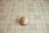 Grandpa's Twin beige plaid newborn posing fabric with wooden posing ball showing the soft oatmeal and cream check pattern for newborn photography.