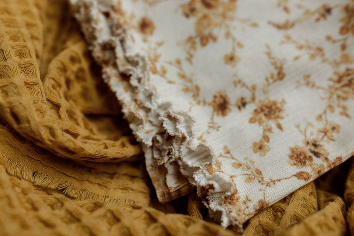 Golden Bloom Ruffle Wrap