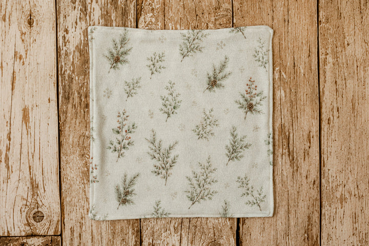 Mantle Garland floral mini lovie blankie featuring evergreen branches and subtle berry details on cream fabric for newborn photography.