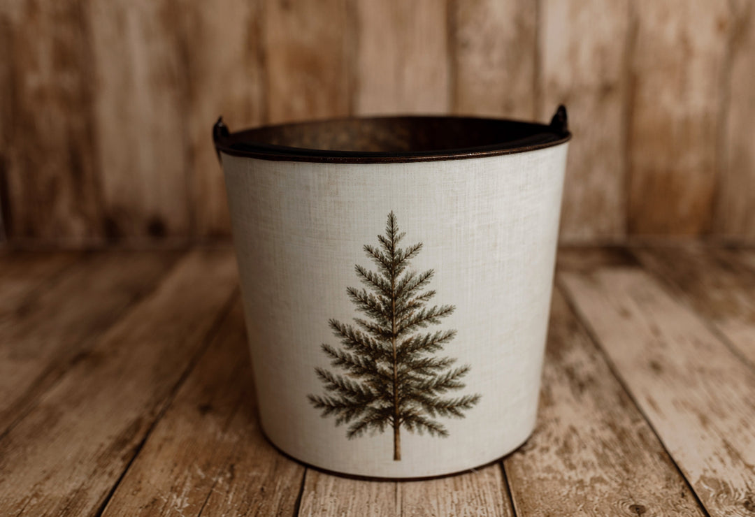 Product photo: Vintage metal newborn posing bucket wrapped in Little Evergreen removable Christmas bucket cover with a simple pine tree design.