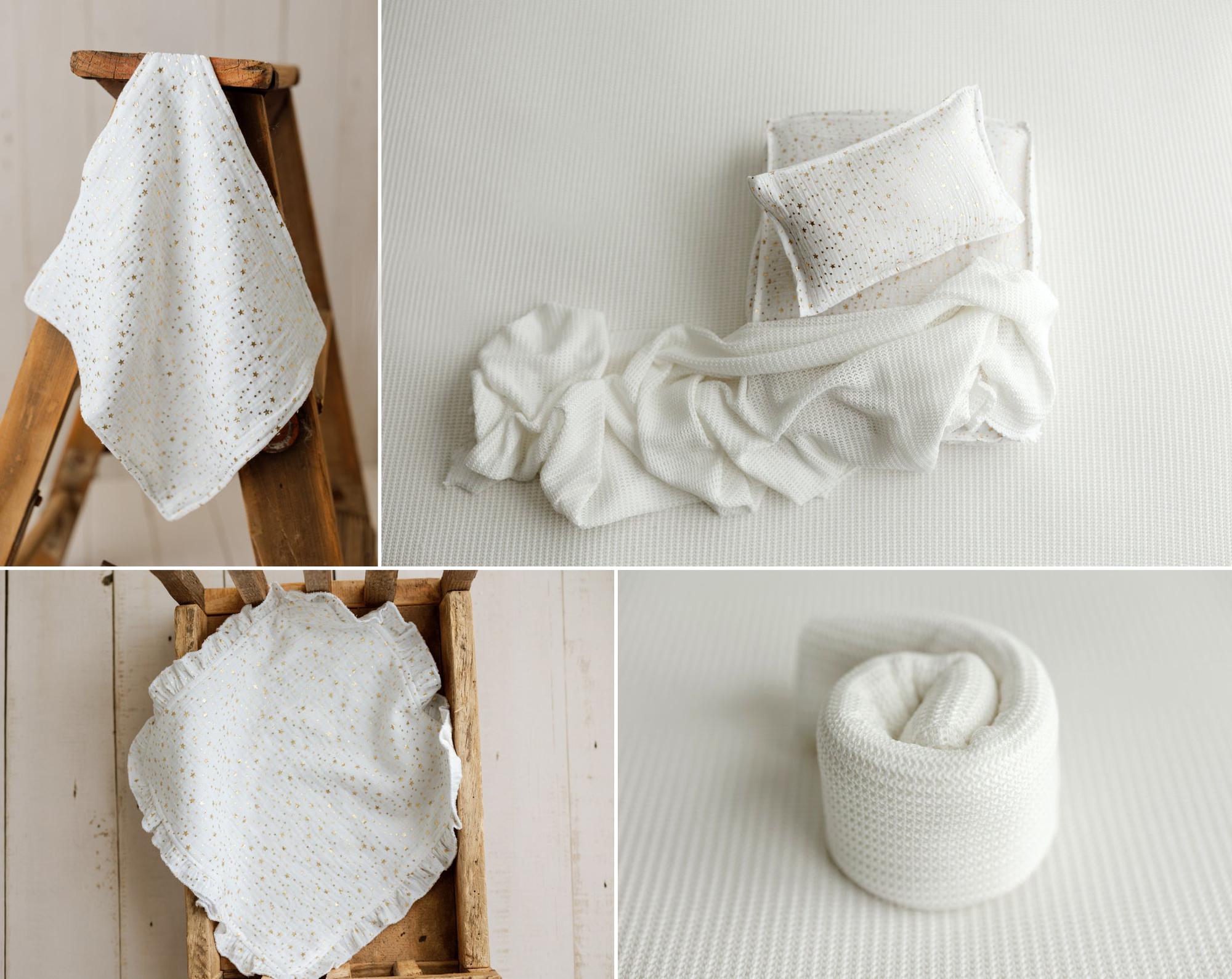White newborn photography props featuring a delicate metallic gold star pattern on soft white fabric, including a ruffled mini blanket, matching newborn pillow and sheet set, and coordinating white knit wrap for newborn photo sessions.