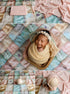 Pastel patchwork quilt photography backdrop featuring realistic stitching and muted blush, sage, and blue fabric squares.