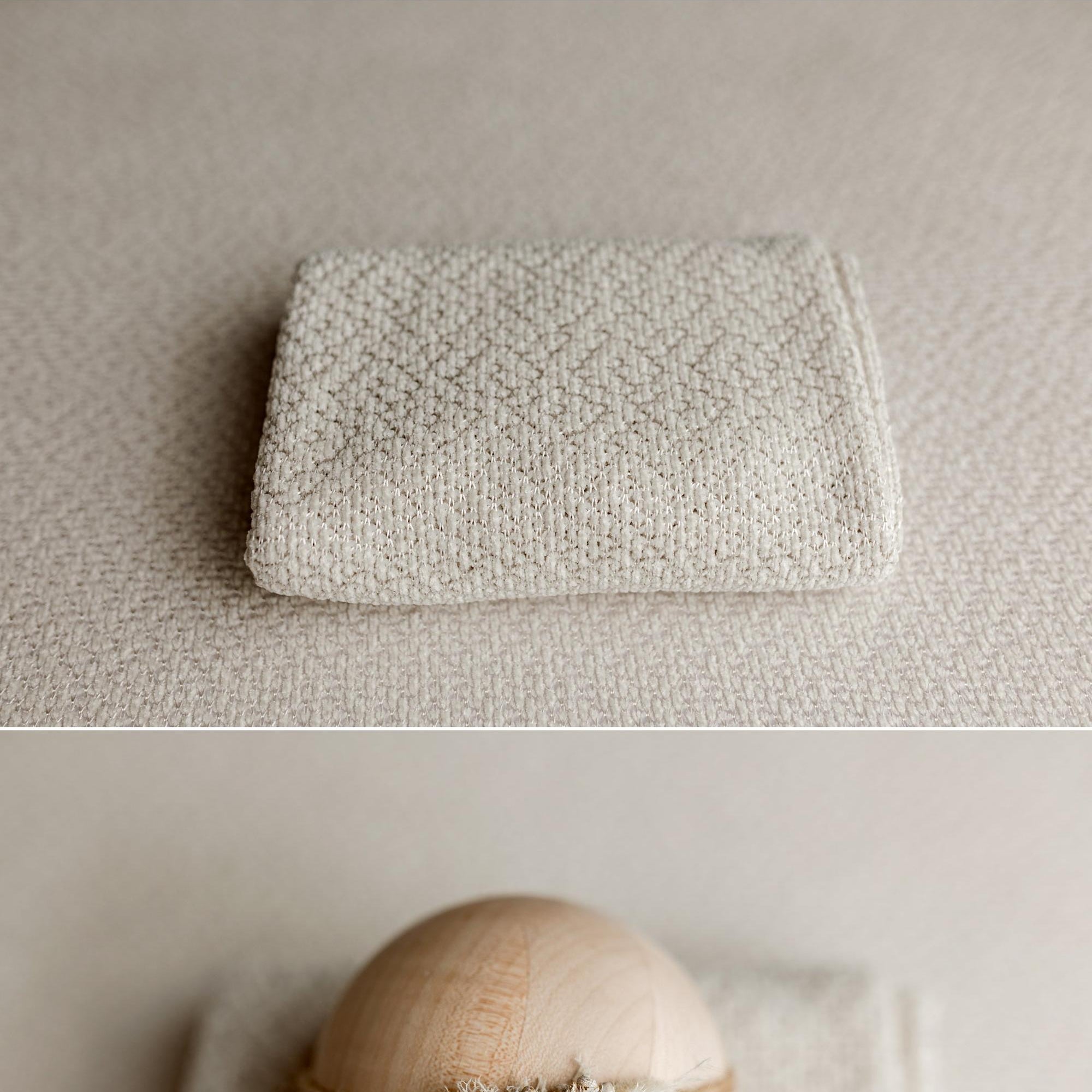 Ivory newborn posing pillow case with a subtle textured knit and gentle woven shimmer for photography props.