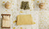 Andrena floral fabric backdrop with butter yellow knit wrap and coordinating newborn photography props.
