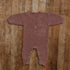 Plum knit sitter romper with button front, styled flat on wooden floor for milestone photography props.